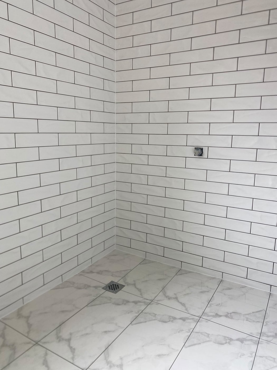 White subway wall tiling in a Perth shower