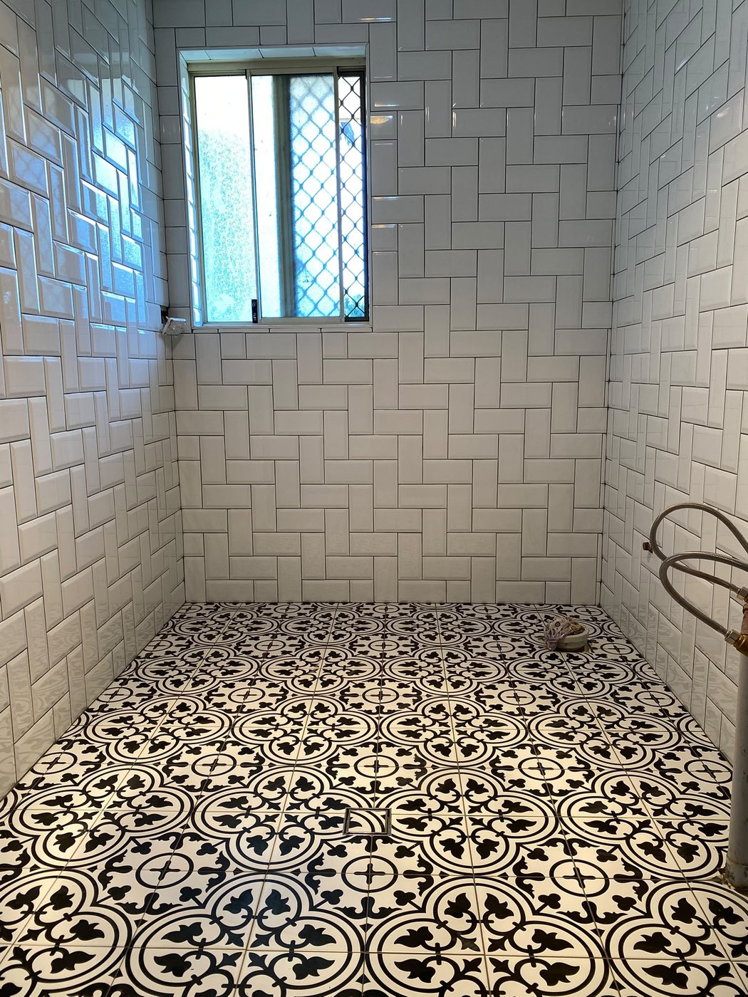 Encaustic feature strip with subway tiling in a Perth bathroom